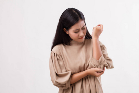 从肘部关节痛, 类风湿或痛风关节炎的痛苦的女人照片
