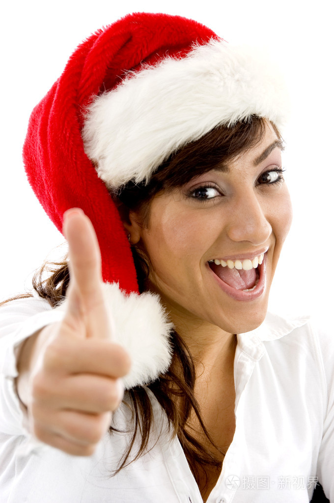 戴圣诞帽的女性竖起大拇指