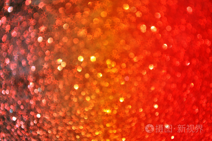 闪闪发光的明亮和抽象模糊的红色彩虹背景闪光