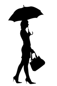 带伞剪影的步行妇女
