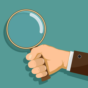 拿着放大镜的人图片