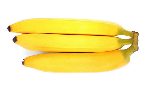 三个新鲜和亮黄色的香蕉，孤立的白色背景上的一个分支。香蕉。水果。维生素