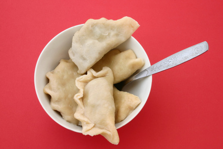 汤团( dumpling的名词复数 ) 饺子 水果布丁 矮胖的人照片