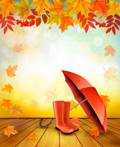 自然秋天背景与五颜六色的树叶和一把雨伞。V
