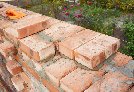 砖砌体中下水道砖砌体矢量标志与铲和砖墙砖砌体在新房子里砖砌体墙体