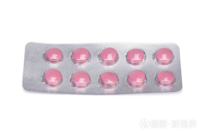 粉红色的药片一包.与掺杂或维生素的小药丸.医疗