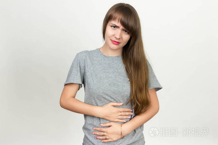一位漂亮的女子,与胃问题的肖像