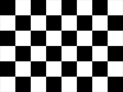 到达终点赛车到达终点时挥动的黑白方格旗照片