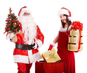 圣诞老人和圣诞女孩拿着礼物。
