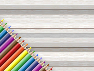 彩色铅笔与副本空间上木制背景孤立