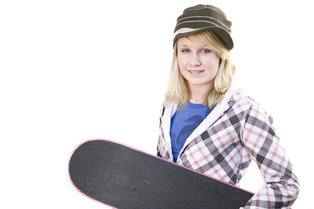 一个年轻的少女在玩滑板图片