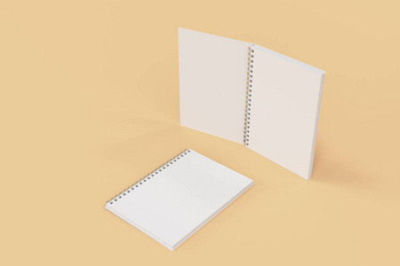 两个笔记本与螺旋装订上橙色背景
