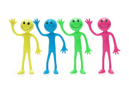 不同颜色隔离在白色的四个表情符号照片