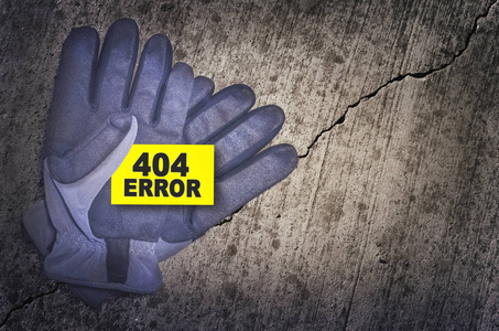 404 错误卡在深色背景上的防护手套