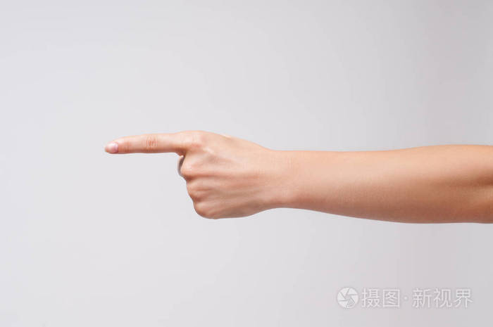 女子手里一根手指指白色背景上的什么东西照片 正版商用图片021cnk 摄图新视界 女子手里一根手指指白色背景上的什么东西照片 正版商用图片021cnk 摄图新视界