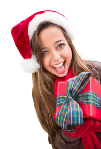女孩穿着圣诞帽与弓包裹的礼物 Iisolated 白色