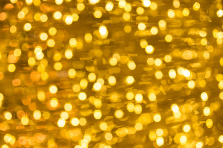 金色的圣诞灯抽象灯散景背景