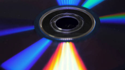 光盘或 dvd 的背景。光盘上的眩光, 从光的美丽的彩色眩光, 背景磁盘 dvd