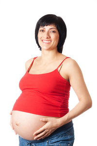 微笑的孕妇拥抱着肚子