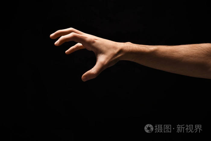 男性手拾起某事 开关在黑色照片 正版商用图片02f3k2 摄图新视界