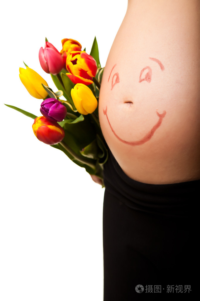 怀着郁金香的孕妇肚子照片-正版商用图片02f7q4-摄图新视界