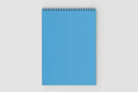 白色背景金属螺旋带的空白蓝色笔记本