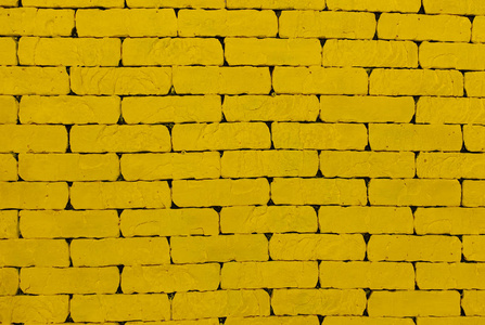 一堵黄墙.黄色的砖.大砖墙照片