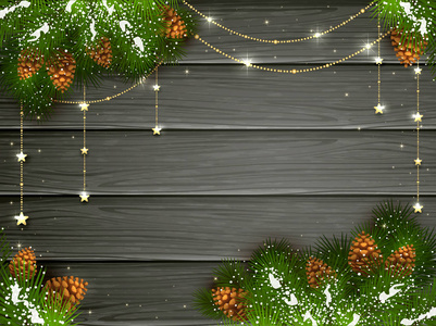 黑色木制背景上的金色圣诞装饰品。