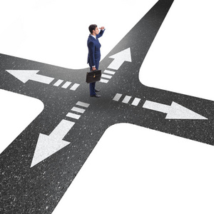 不确定概念交叉路口的年轻商人照片