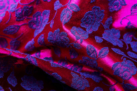 红色面料背景片段彩色复古挂毯纺织图案与花卉装饰有用的背景