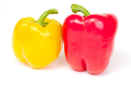红椒和黄椒在白色背景上分离图片