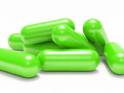 许多绿色闪亮的医疗药丸胶囊