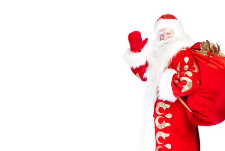 圣诞老人站起来与他的完整的包在白色背景上