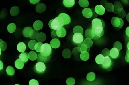 绿色抽象的圣诞节模糊的发光背景。弥散艺术散景灯形象
