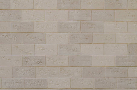水泥和混凝土接缝的旧白色和米色砖壁表面的纹理