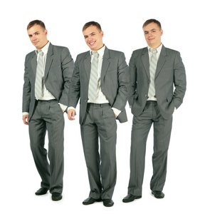 三个穿西装的快乐商人站在白色背景公司