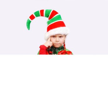 女孩圣诞老人精灵与白色旗帜照片