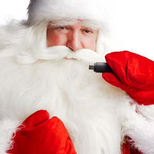 传统圣诞老人在他手臂上 foreg 举行 3g usb 调制解调器