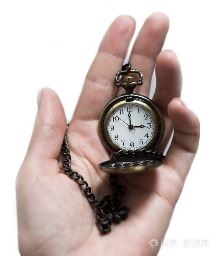 老式的旧手表上链手中拿着一只手表上链