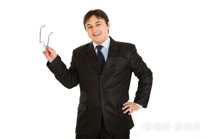 优雅年轻的商人在手拿眼镜