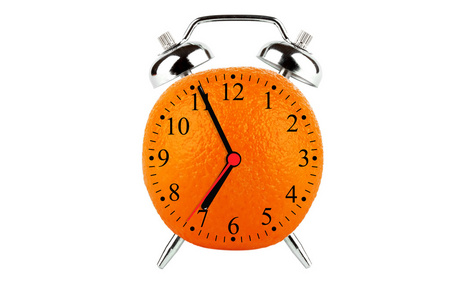 橙色水果闹钟照片