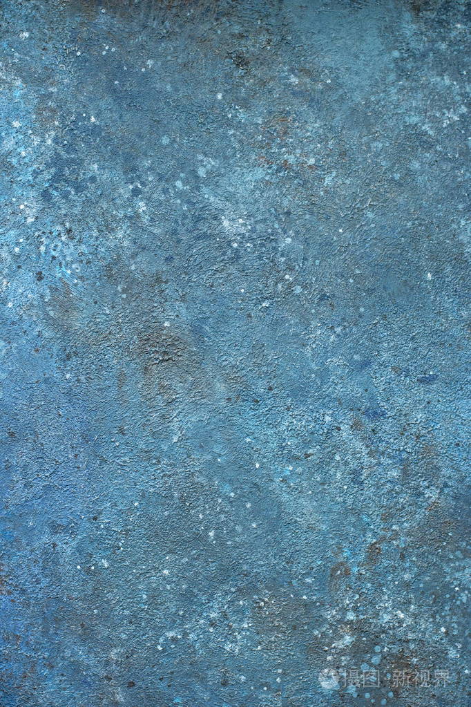 背景的蓝色灰泥涂和画外粗糙水泥和混凝土墙体纹理的铸装饰涂料