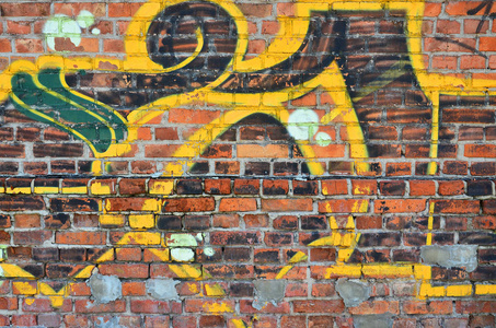 墙上的一个片断的纹理与涂鸦绘画, 这是描绘在它。在街头艺术和涂鸦文化话题上画一幅涂鸦图片