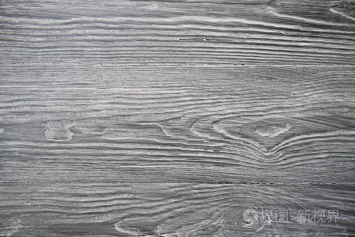 灰色木板与风化的裂缝线.自然背景的破旧别致的设计.灰色木地板形象.