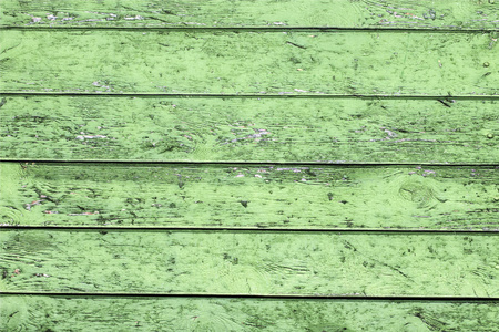天然木质背景。旧漆绿色板