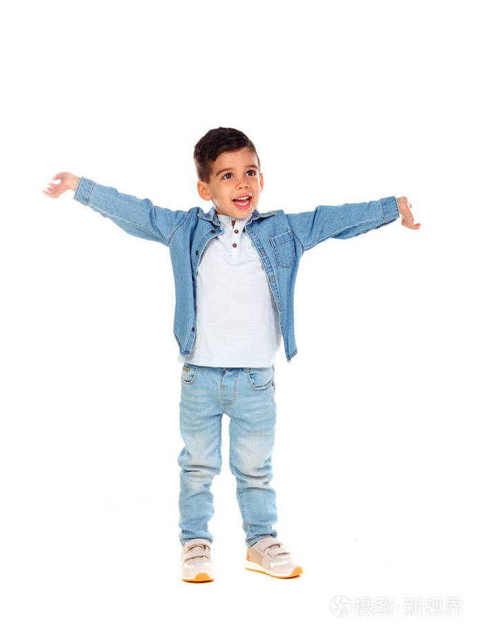 微笑的小男孩在牛仔服装跳舞隔绝在白色背景上