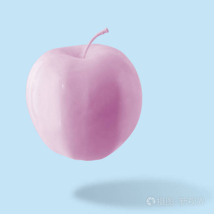 粉红色的苹果在蓝色背景最小的样式食品概念