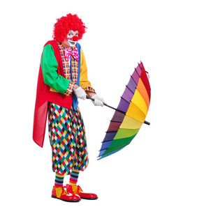 美术图片雨伞侧面视图全长图片的小丑持有打开的雨伞照片