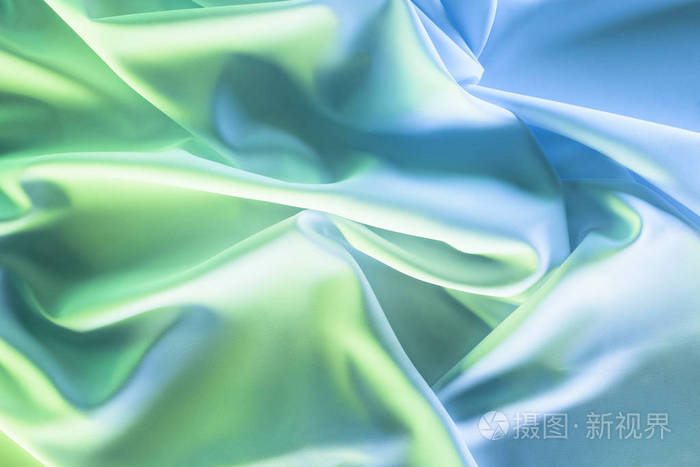 绿色和蓝色软丝绸布料的色调的图片作为背景