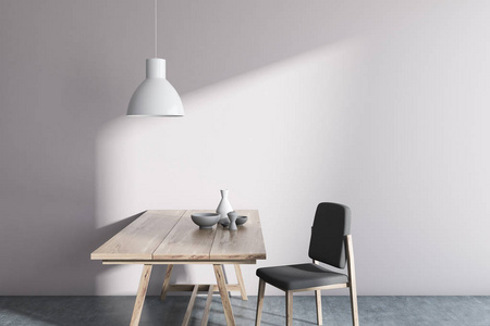 简约白墙白墙简约斯堪的纳维亚风格的餐厅内有混凝土地板, 一张木桌和